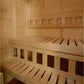 Natural wood 2-person corner sauna interior with slatted benches and ventilation openings
