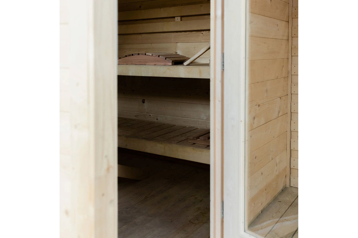 Almost Heaven Timberline sauna interior showing wooden benches and slatted walls, open door view