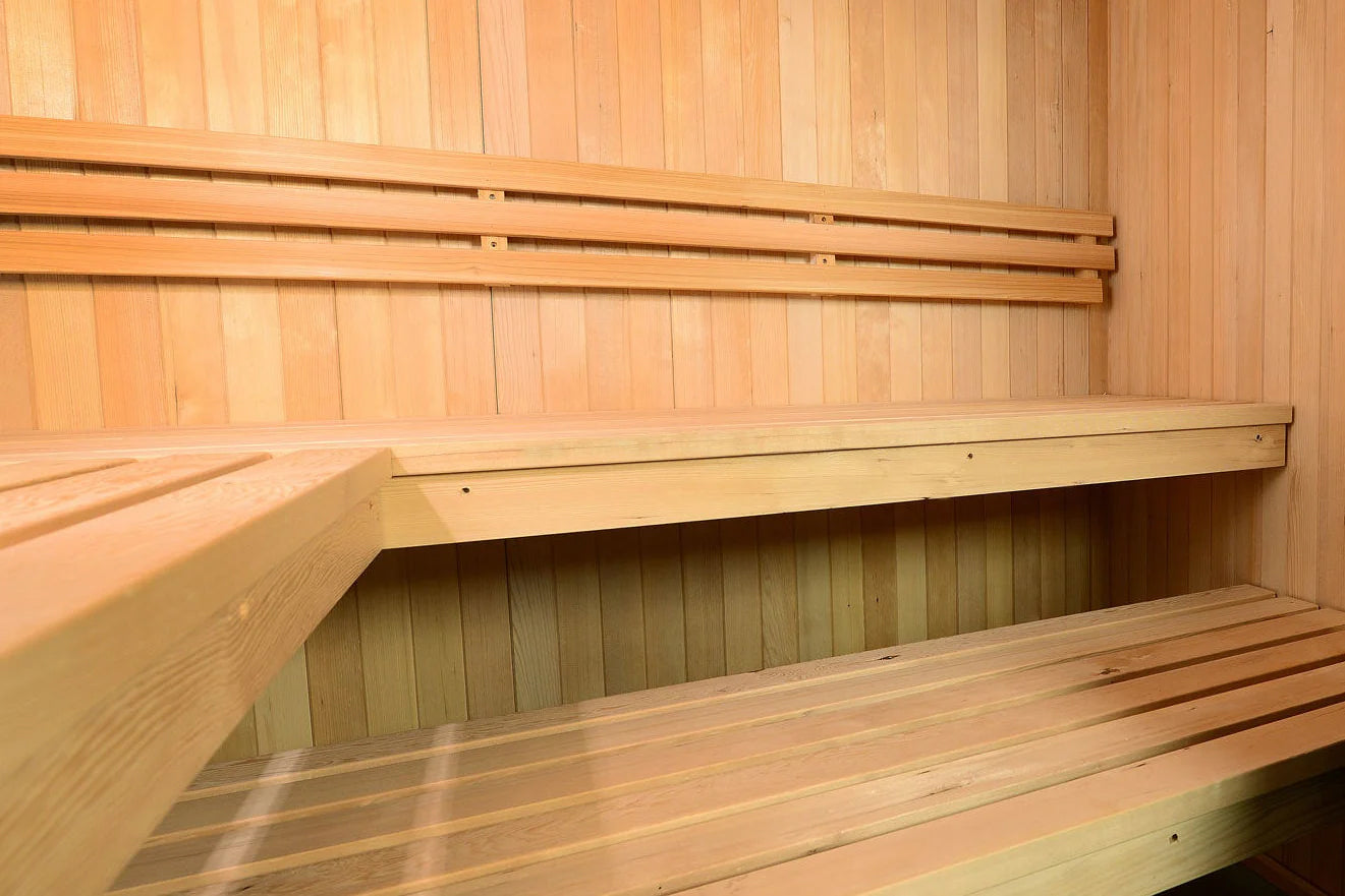 Almost Heaven Titan 6-person indoor sauna with cedar wood benches and paneled interior, flat lay