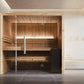Almost Heaven Titan 6-person indoor sauna with light pine wood interior, glass doors, two-tier benches, and interior lighting