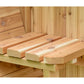 Natural wood bench seating with four rounded cedar logs inside wooden sauna, flat lay view