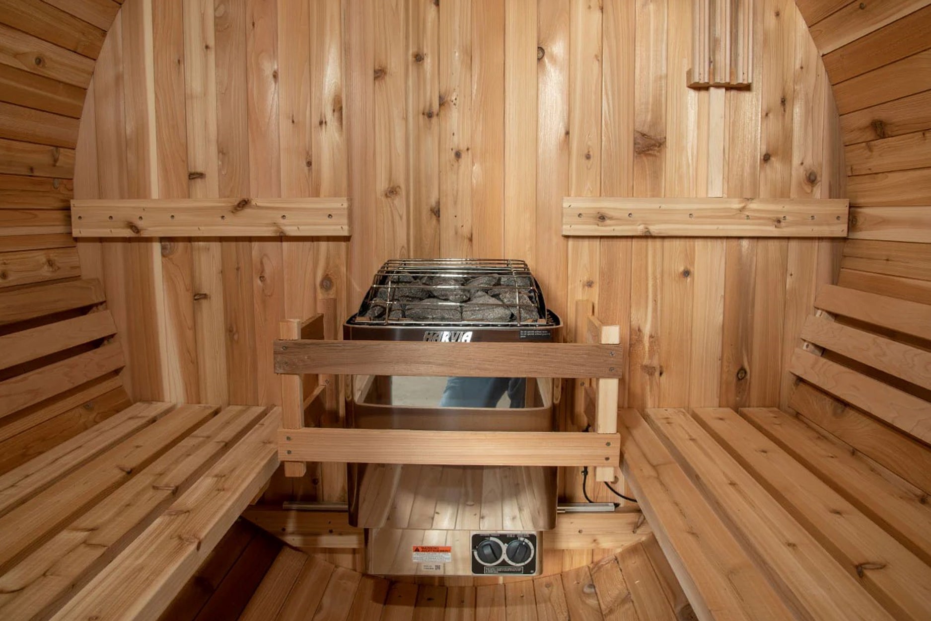 Almost Heaven Watoga 4-person barrel sauna interior with cedar wood benches, arched ceiling, and stainless steel heater with 