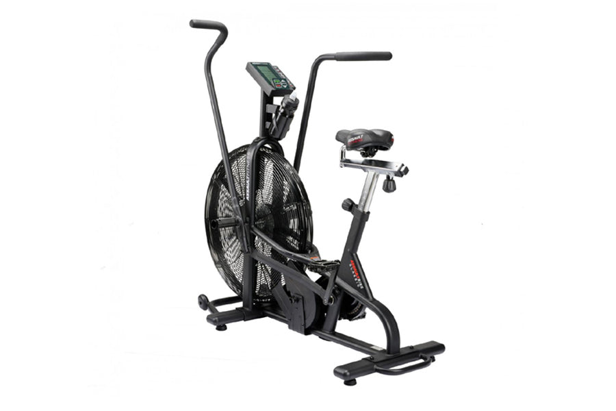 Black upright stationary air bike with large fan wheel, digital display console, and adjustable seat on white background