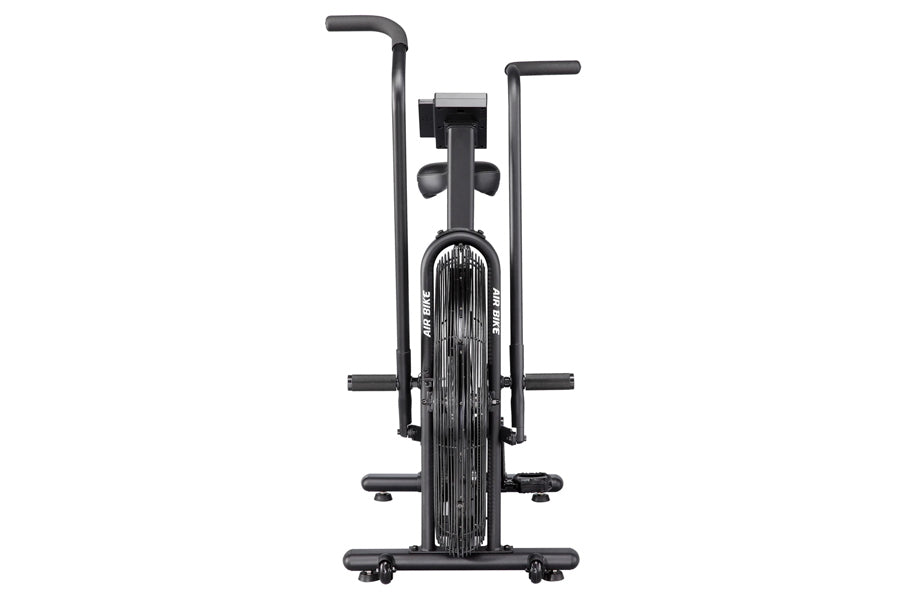 Black stationary air bike with dual handles, foot pedals, and large front fan wheel on white background