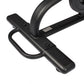 Black stationary exercise bike pedal and frame detail with curved handlebar, shown on white background