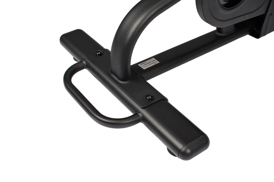 Black stationary exercise bike pedal and frame detail with curved handlebar, shown on white background