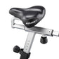 Assault AirBike stationary exercise bike with black padded seat, silver frame, and adjustment knob on white background