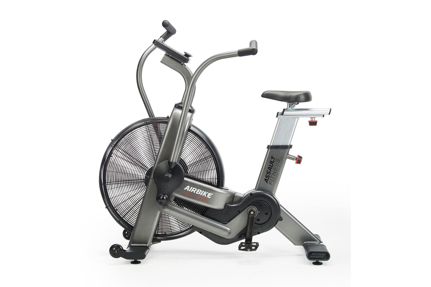 Assault Elite Air Bike with silver frame, large black fan wheel, dual handlebars, and black padded seat on white background