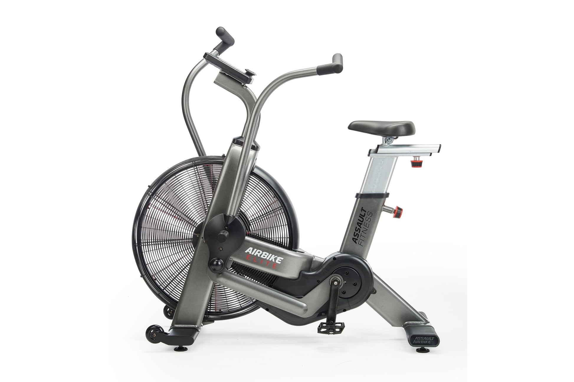 Assault Elite Air Bike with silver frame, large black fan wheel, dual handlebars, and black padded seat on white background