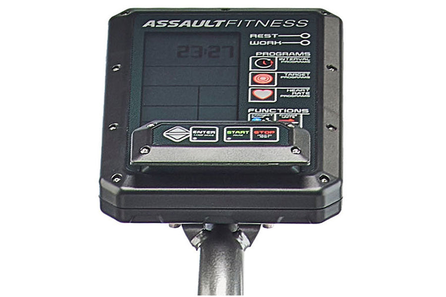Assault Fitness console with digital display showing 22821, mounted on gray pole with rest/work program buttons and start/sto