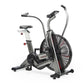Assault Elite air bike with large black fan wheel, gray and black frame, upright seat, dual handlebars, and digital display o