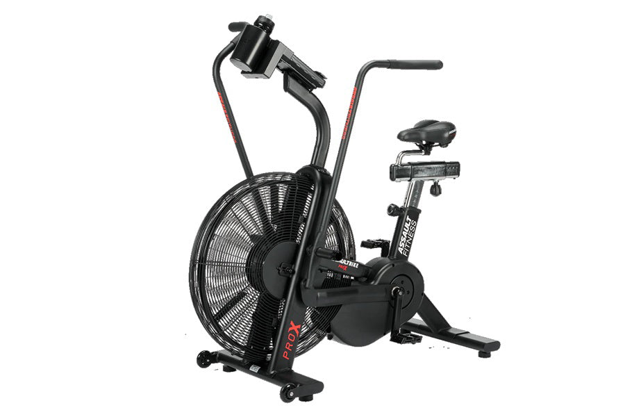Black air bike exercise machine with large fan wheel, dual handles, and padded seat on white background