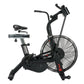 Black AssaultBike Pro X air bike with large fan wheel, curved handlebars, padded seat, and digital display on white backgroun
