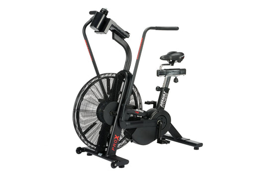 Black air bike with large fan wheel, upright handlebars, and stationary seat on white background