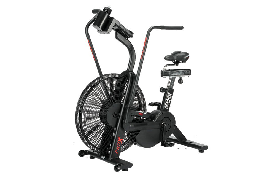 Black stationary air bike with large fan wheel, handlebars with phone holder mount, and padded seat on white background