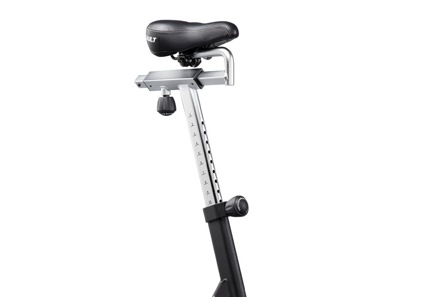 Stationary exercise bike with black padded seat, silver metal frame, and adjustment knob on white background