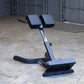 Body-Solid hyperextension machine with dual padded foot rests and adjustable back support on concrete floor