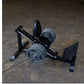 Body-Solid compact leg press and hack squat machine with black frame, dual weight plates, and gray foot platform on concrete 
