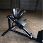 Black and silver compact leg press and hack squat machine with five weight plates loaded on top, displayed in garage setting