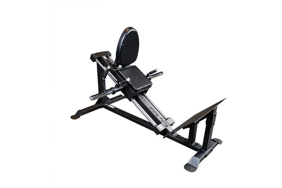 Black and silver compact leg press and hack squat machine with padded seat, footplate, and circular backrest on white backgro