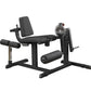 Black leg extension and curl machine with padded seat, backrest, and leg attachments on white background