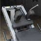 White and gray leg press machine with black padded seat and footrest, adjustable handles, flat lay view