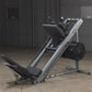 Body-Solid leg press and hack squat machine with silver frame, black seat and footplate, loaded with black weight plates, in 