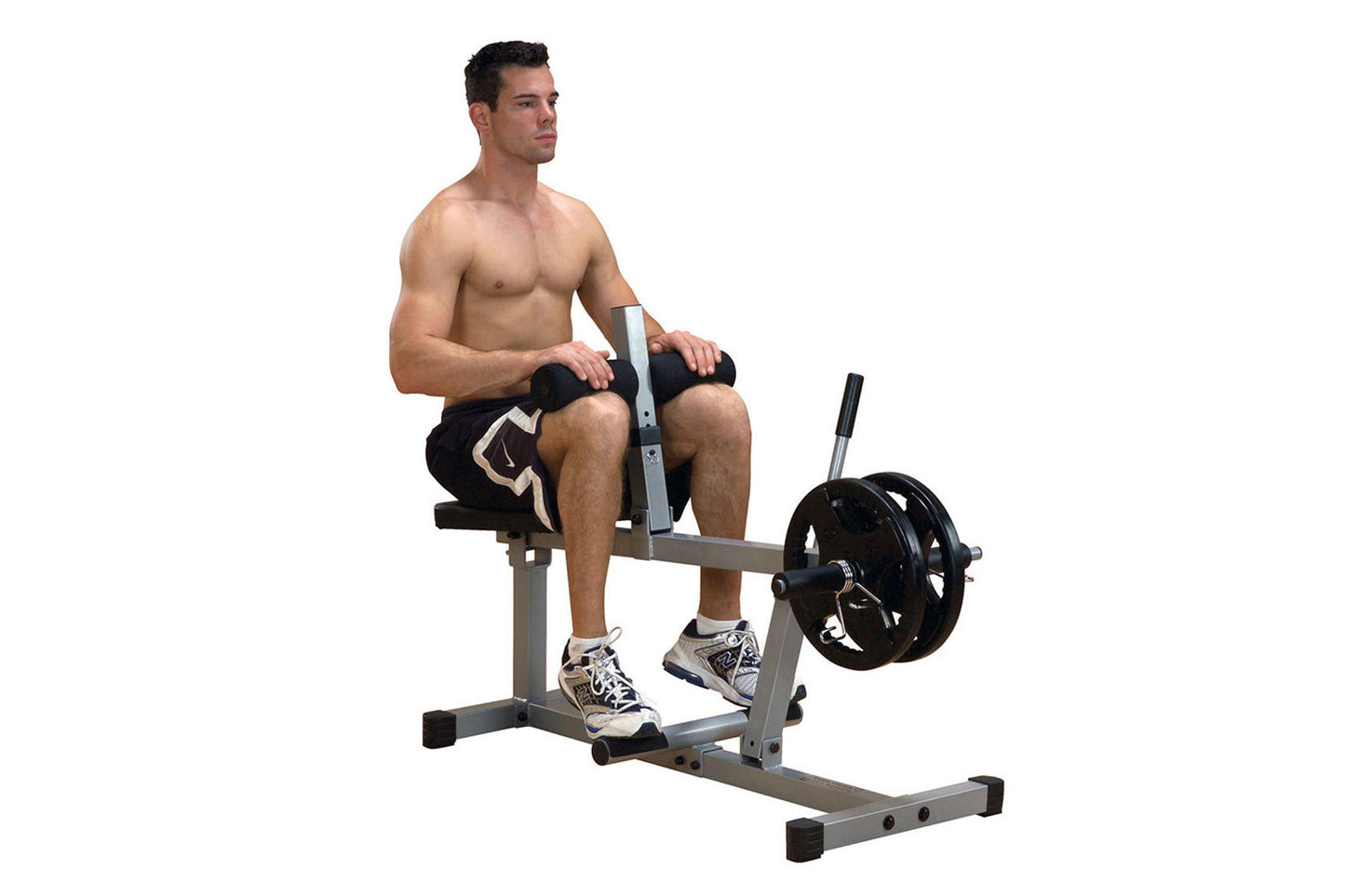 Man using silver and black seated calf raise machine with weighted barbell, demonstrating exercise form on white background