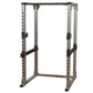 Body-Solid Pro Power Rack with gray and black steel frame, adjustable safety bars, and perforated upright posts on white back