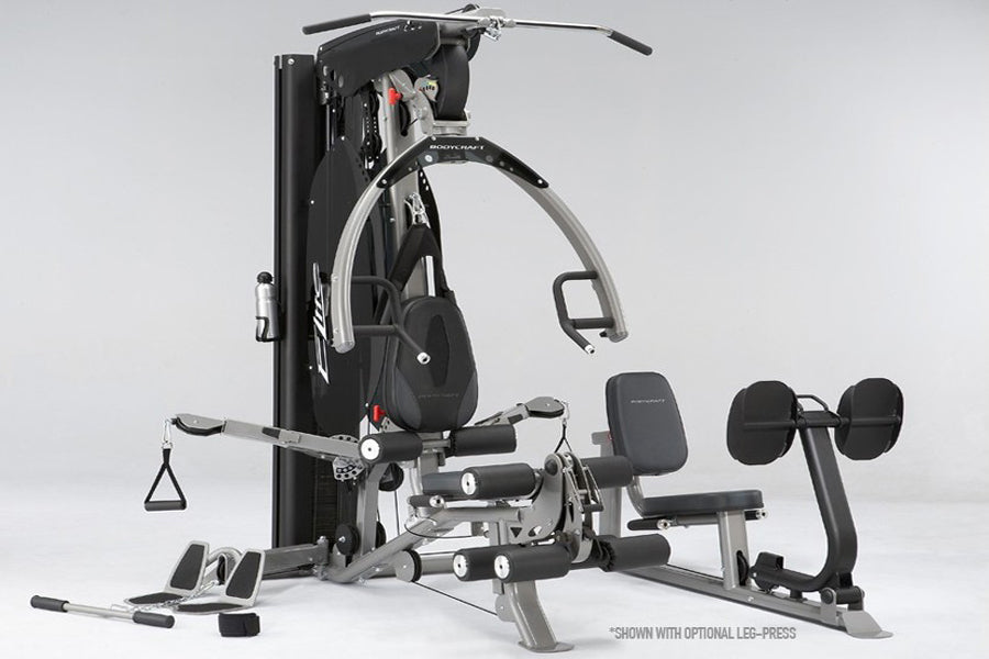 BodyCraft Elite black and silver multi-station home gym with leg press, arm machine, and weight stack on white background