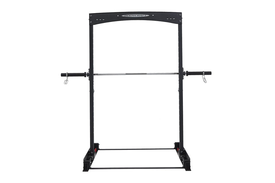 Black power rack with pull-up bar and dip attachment on white background