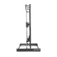 Black and silver vertical Smith machine with dual guide rails, adjustable safety catches, and wide base stand on white backgr