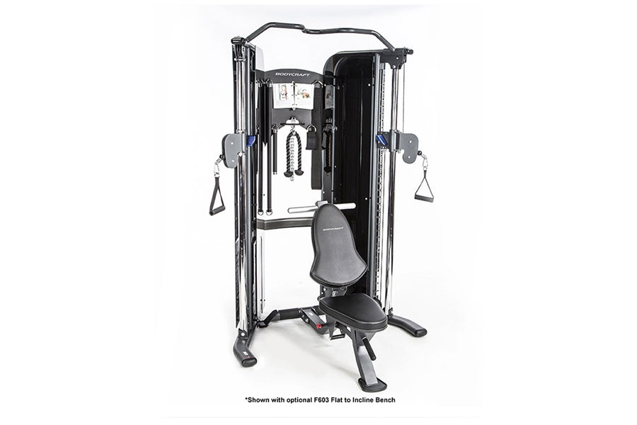 Black and silver functional trainer machine with dual cable towers, adjustable pulleys, and black seat on white background