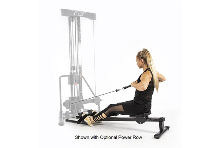 Woman using BodyCraft PFT Functional Trainer with optional power row attachment, seated on black bench with cable in extended