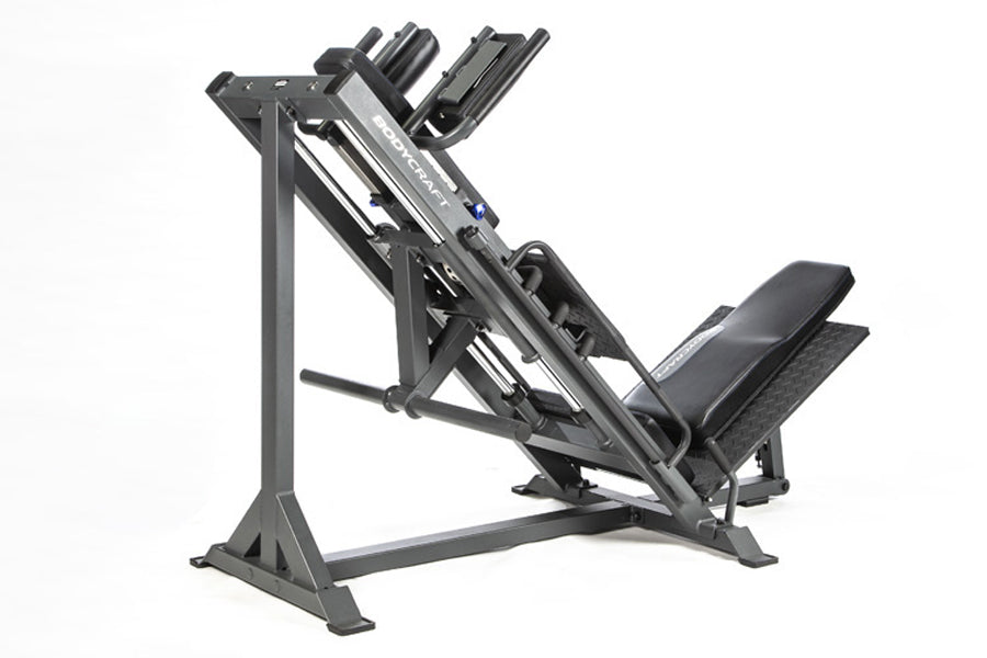 Black and gray BodyCraft Pro leg press and hack squat machine with padded seat and footplate on white background