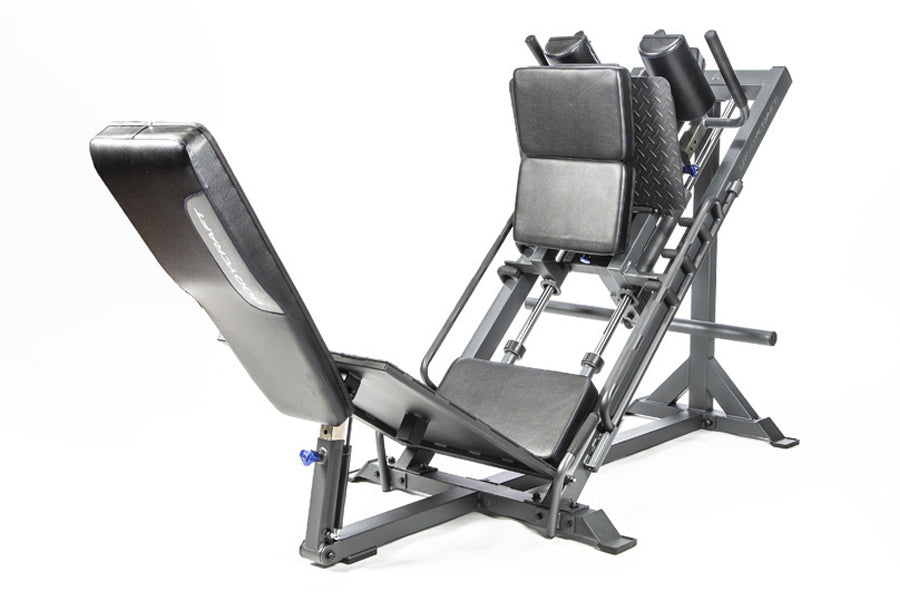 Black and gray leg press machine with padded seat, angled footplate, and adjustable back support on white background