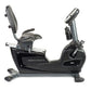 BodyCraft R200 semi-recumbent exercise bike with black frame, gray padded seat and backrest, digital display console, and foo