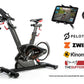 BodyCraft SPR indoor stationary exercise bike in black with red accents, shown with tablet holder, heart rate monitor, and co
