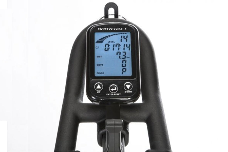 Bodycraft SPR stationary exercise bike with digital console displaying time, calories, watts and pulse metrics on white backg