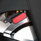 Stationary bike resistance pad with red cushion and black metal lever adjustment mechanism mounted on chrome frame