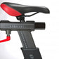 Black and red stationary exercise bike seat with resistance adjustment dial and numbered settings on white background