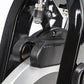 Black and silver stationary bike brake caliper and frame detail on white background