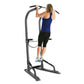 BodyCraft T3 Total Training Tower with woman performing pull-up exercise, gray steel frame on white background