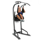 Woman using gray and black vertical training tower with pull-up bar and leg raise station on white background
