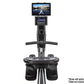 Black BodyCraft rowing machine with digital display console, tablet holder mount, and dual foot pedals on white background