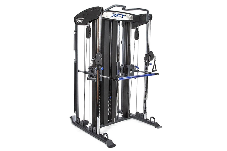 BodyCraft XFT Functional Trainer with dual cable towers, blue handles, and black frame on white background