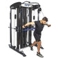BodyCraft XFT functional trainer with black and white frame, shown being used by male model in black shirt performing cable e