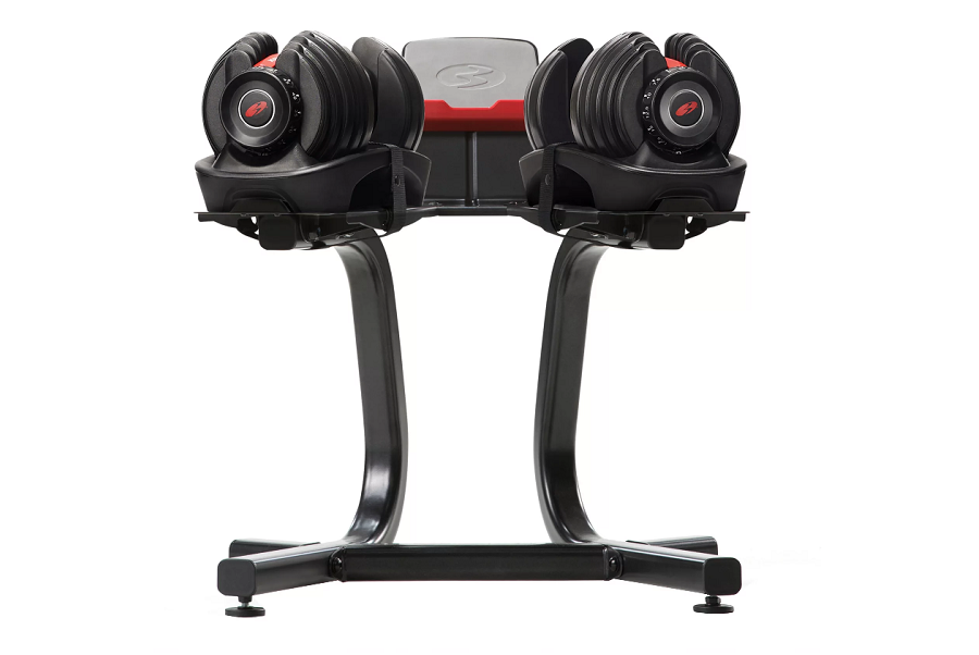 Bowflex SelectTech adjustable dumbbell stand with two black dumbbells and red accents on white background