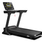 Black motorized treadmill with digital display tablet mounted on top showing workout metrics and yellow circular interface, o