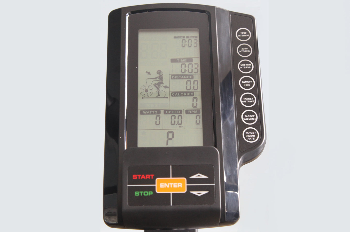 Black exercise bike console with LCD display showing time, distance, calories, watts, speed and RPM metrics, featuring orange